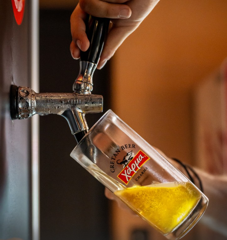 Pouring Charma Cretan beer from the tap